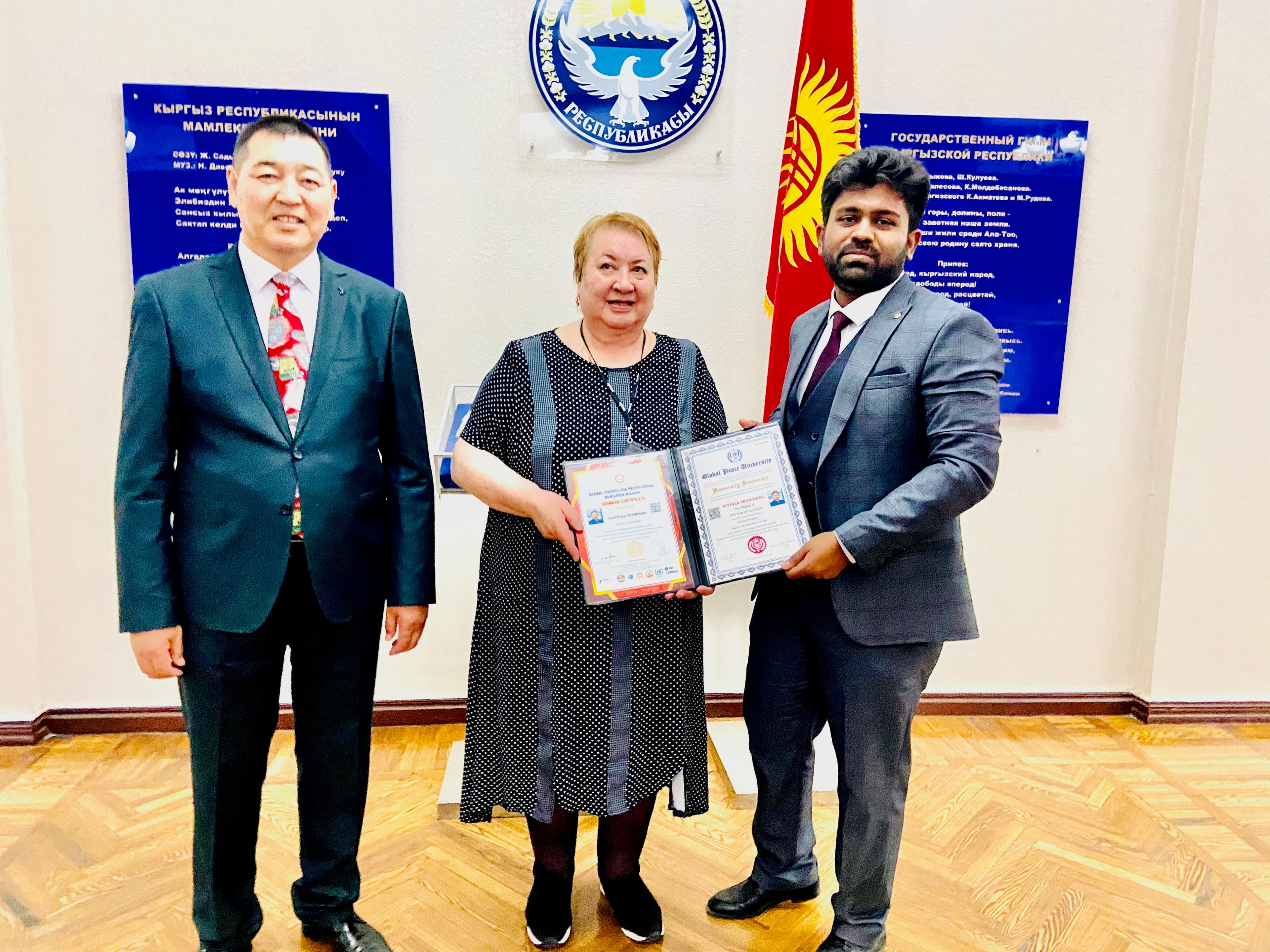 Receiving honorary doctorate from Prof. Indira Orozobaevna Kudaibergenova and Prof. Ziiabidin Aidarov